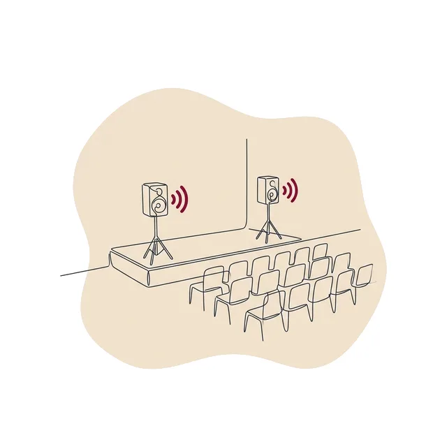 Petite salle de concert vide avec deux enceintes sur scène